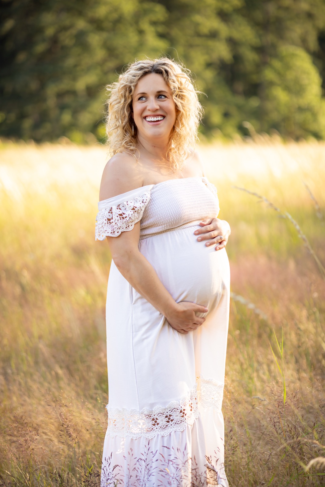Maternity portrait in golden field